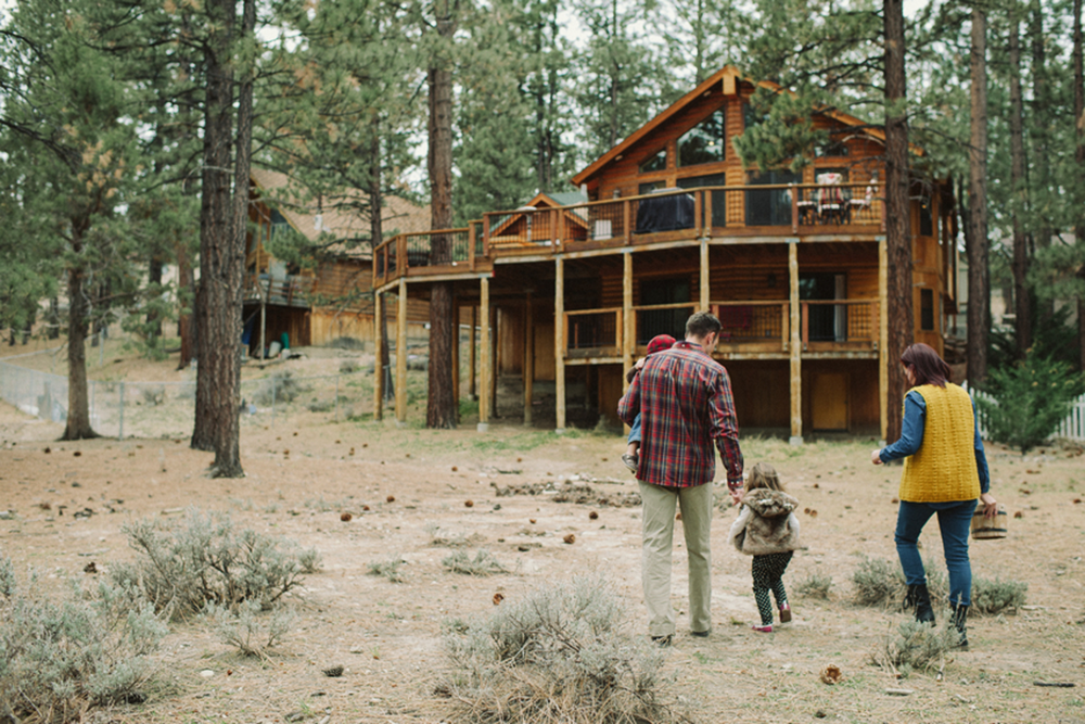 Top 10 Things Actually Worth Spending Your Money On 1 April2015 Trulia 8 Things to Know Before Buying a Vacation Home family walking to cabin